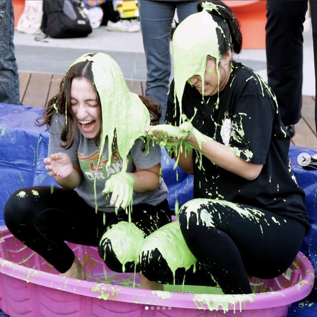 Two Nickelodeon interns being slimed on their last day