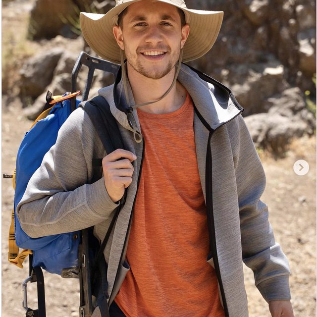 Creator Brandon Martyn hiking in explorer gear for the Exploration track